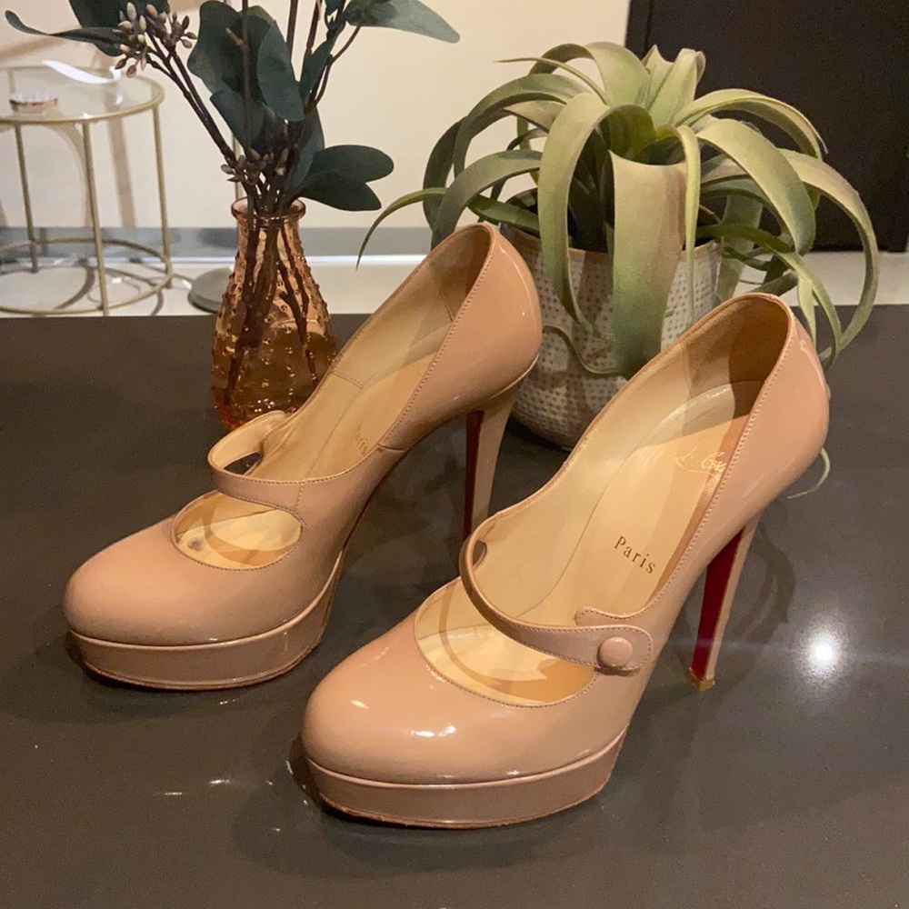 Tan platform Mary Jane Louboutins.